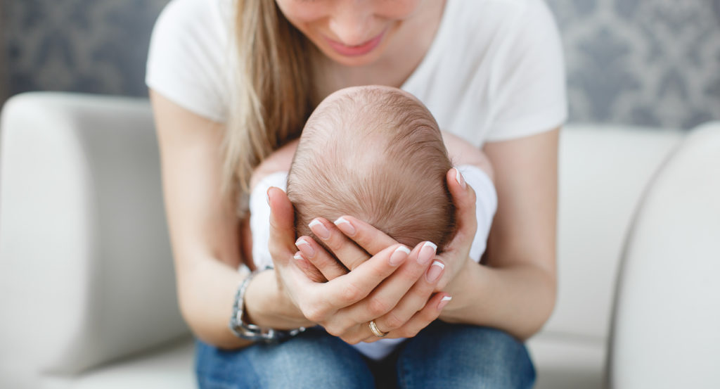 Women holding her baby